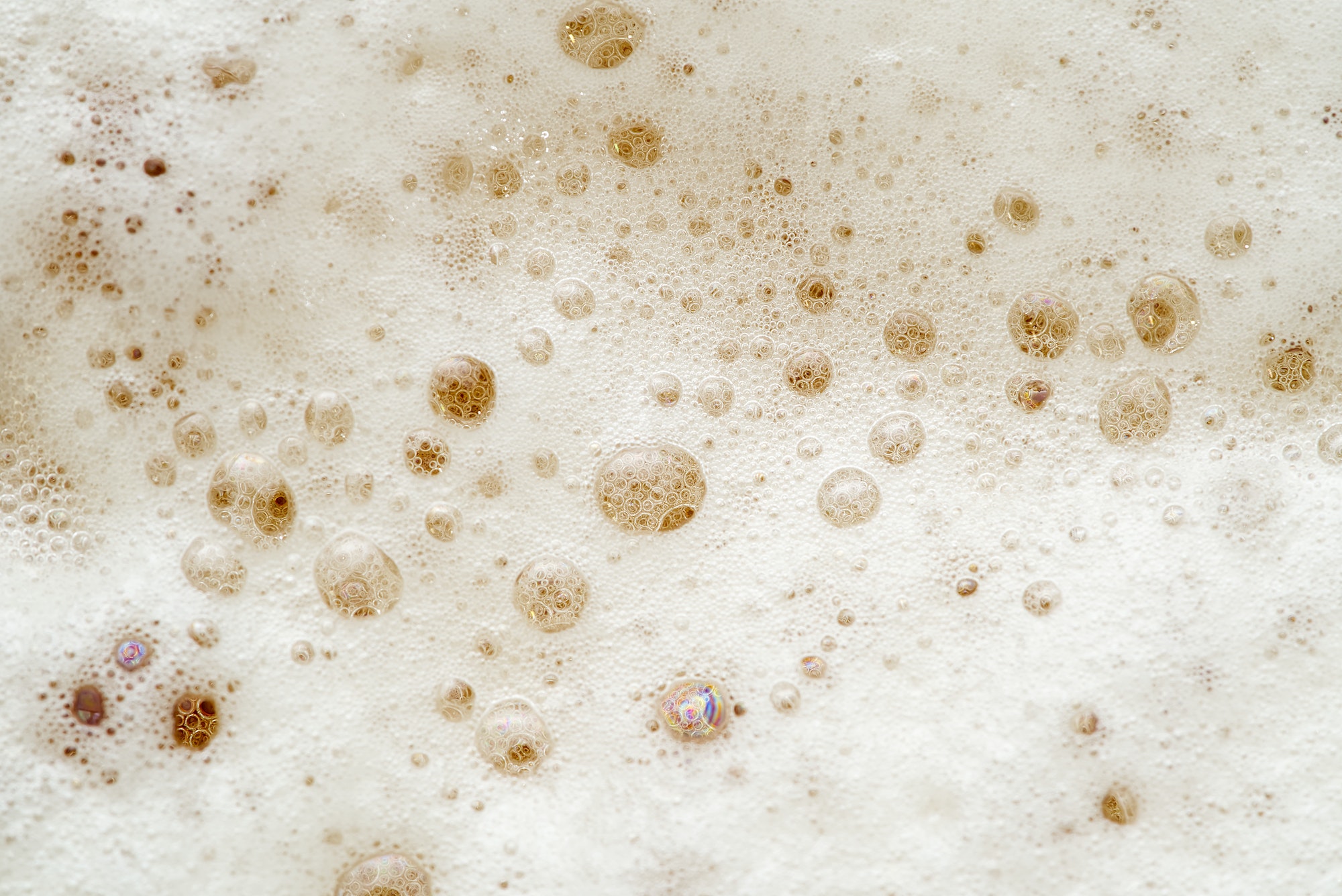 Fresh Beer foam texture. Macro detail of beer bubble and foam.